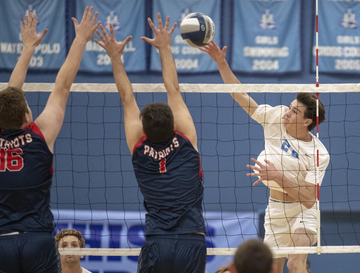 Corona del Mar High's Adam Flood, seen hitting against Beckman on Feb. 21, helped the Sea Kings go 2-0 in the Orange County Championships at Edison High on Friday.