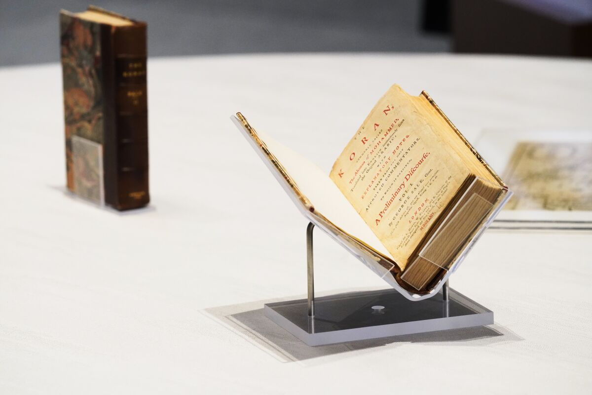 A Quran owned by U.S. President Thomas Jefferson sits on display at the American pavilion at Dubai Expo 2020 in Dubai, United Arab Emirates, Wednesday, Feb. 9, 2022. The Quran, on its first trip ever outside of the U.S. since being bought by Jefferson, had been on display at the Expo under constant guard. It was packed Wednesday to be returned to the Library of Congress. (AP Photo/Jon Gambrell)