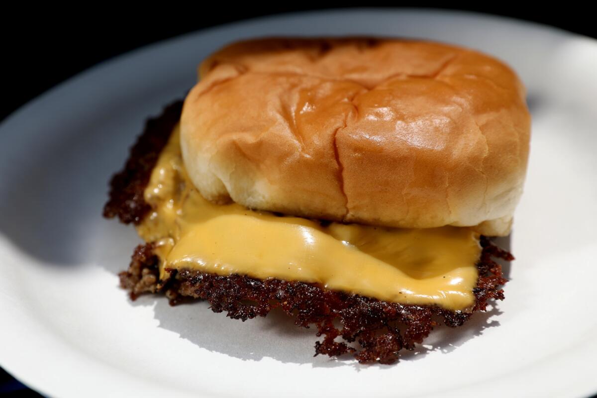 The Smash Burger; a double cheeseburger with ketchup, mustard, pickle and onion, as served by Burgers Never Say Die during a pop-up appearance at the Glendale Tap in Glendale.