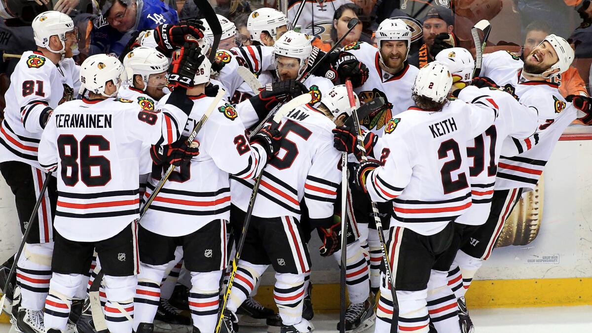 The Chicago Blackhawks celebrate following Marcus Kruger's winning goal in triple overtime of a 3-2 victory over the Ducks in Game 2 of the Western Conference finals at Honda Center on May 19, 2015.