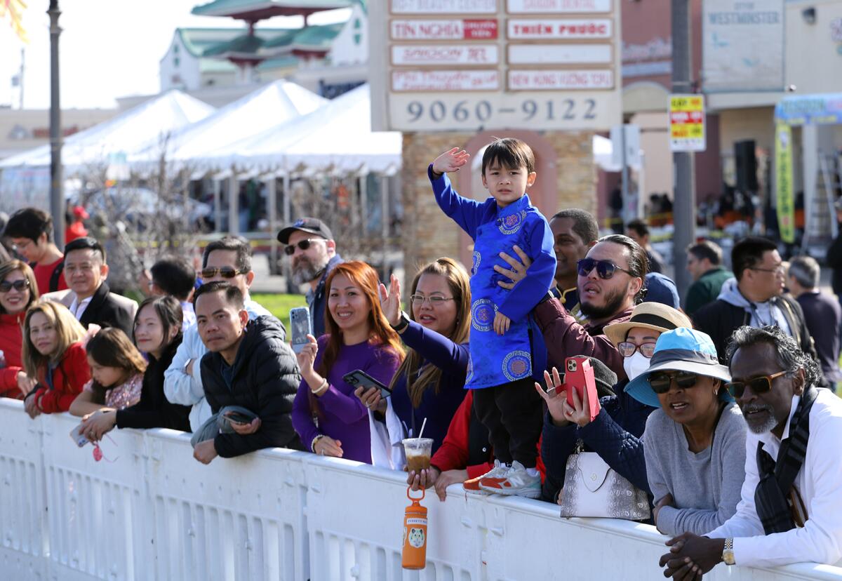 People of all ages watch the 2023 Westminster Tet Parade.