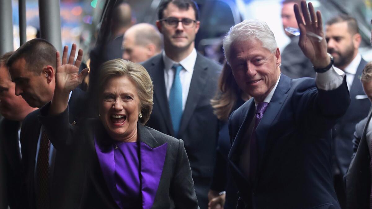 Hillary and Bill Clinton picked purple - a symbol of unity - for the Democratic candidate's concession speech on Nov. 9.