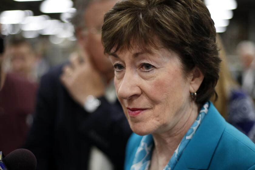 Sen. Susan Collins, R-Maine, takes a question from a reporter on Aug. 17, 2017, in Lewiston, Maine. The last-gasp Republican drive to tear down President Barack Obama's health care law essentially died Sept. 25, as Collins joined a small but decisive cluster of GOP senators in opposing the push.