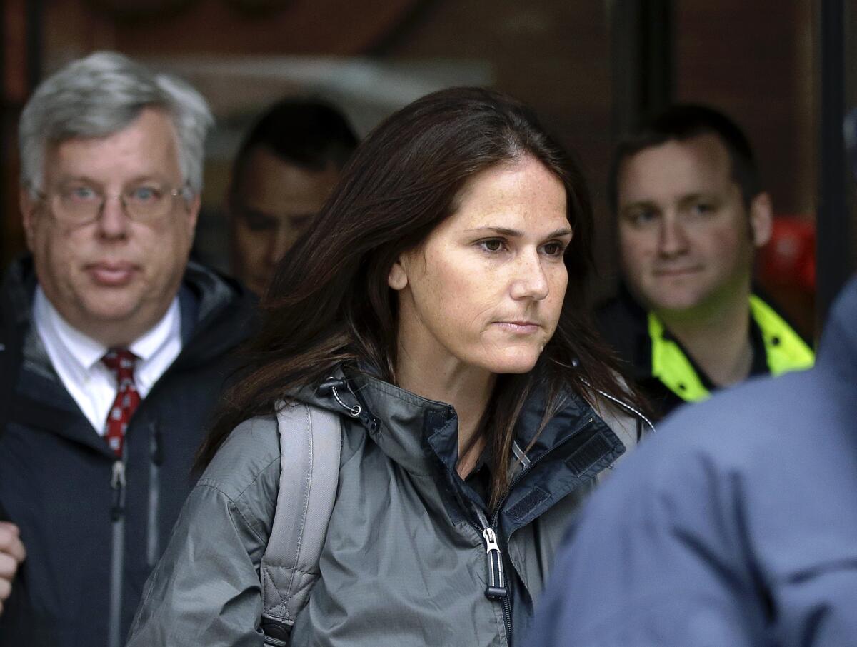 Former University of Southern California soccer coach Laura Janke departs federal court.