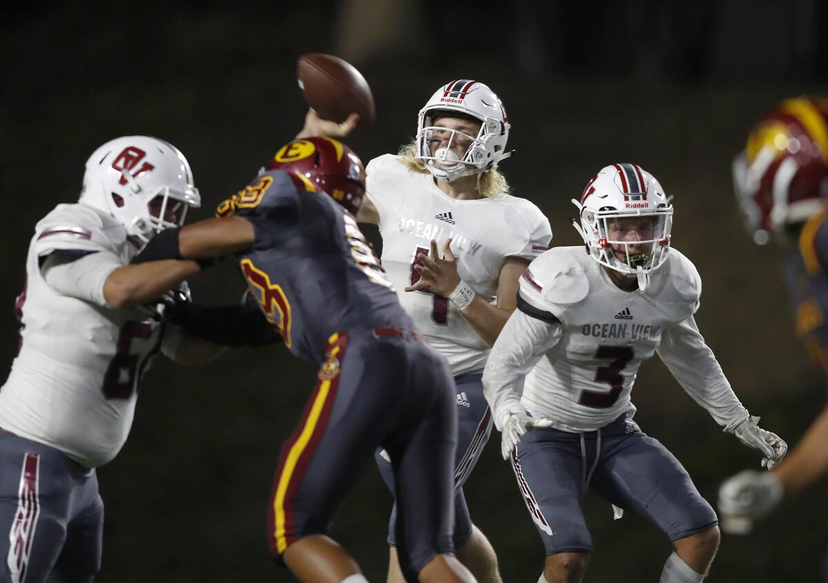 Ocean View quarterback Braden Crabtree, center, seen throwing against Estancia on Sept. 19, led the Seahawks to a 48-14 win over Cerritos on Friday.