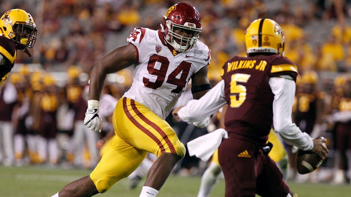 USC defensive lineman Rasheem Green (94) chases down Arizona State quarterback Manny Wilkins (5) during the second half on Oct. 28.