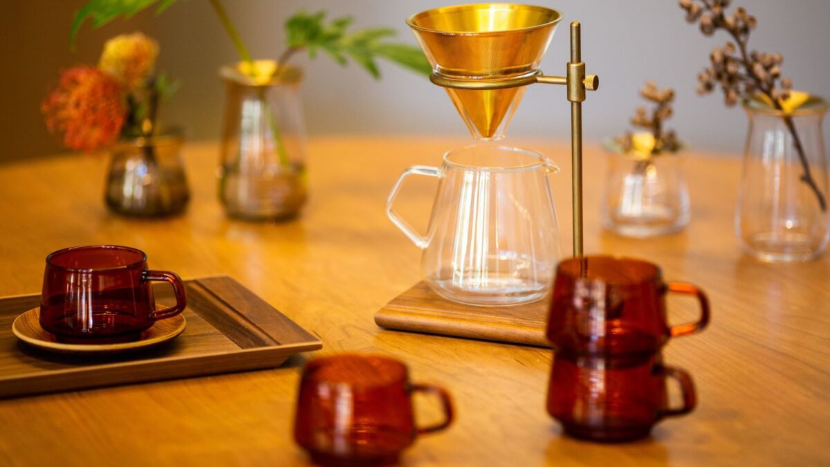 Glass drinkware and coffee dripper on display at Kinto.