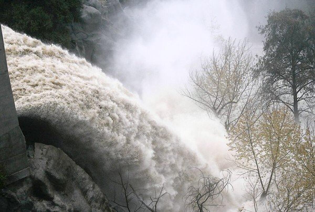 Runoff from the Devil's Gate reservoir in Pasadena in 2005. Officials say sediment and debris behind the dam have compromised its capacity to prevent flooding downstream in major storms.