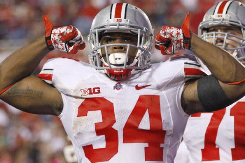 Running back Carlos Hyde reportedly has been kicked off the Ohio State football team in connection with an alleged assault against a woman.