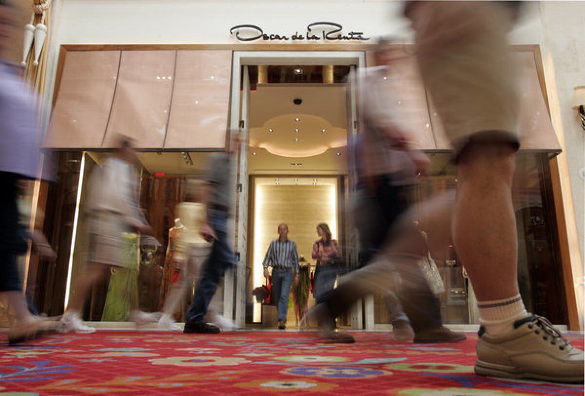 A new study challenges the view that the voices of the wealthy consistently drown out those of the poor. Instead, researchers say, Democratic elected officials side more with the views of low-income constituents while Republican lawmakers side more with their wealthier constituents. Above, shoppers outside the Oscar de la Renta store in Las Vegas.