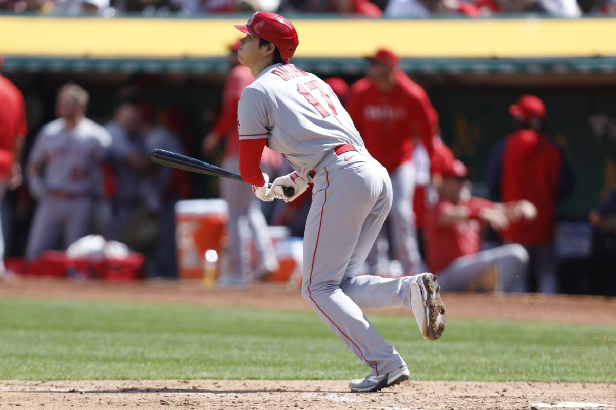 Angels designated hitter Shohei Ohtani hits a home run in the fifth inning of a 6-0 win.