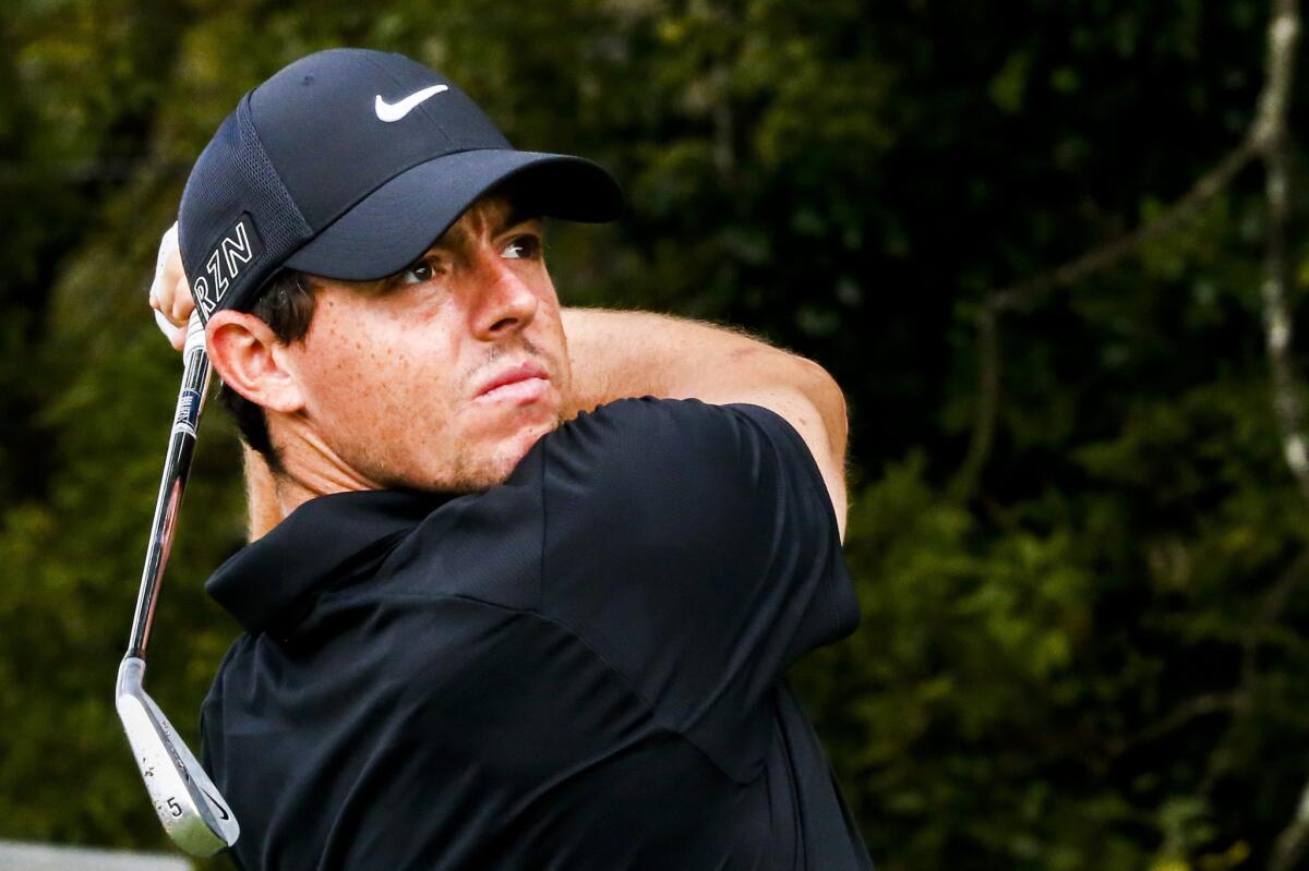 Rory McIlroy of Northern Ireland watches his tee shot on the 11th hole as he practices for the TOUR Championship at East Lake Golf Club in Atlanta on Sept. 23.