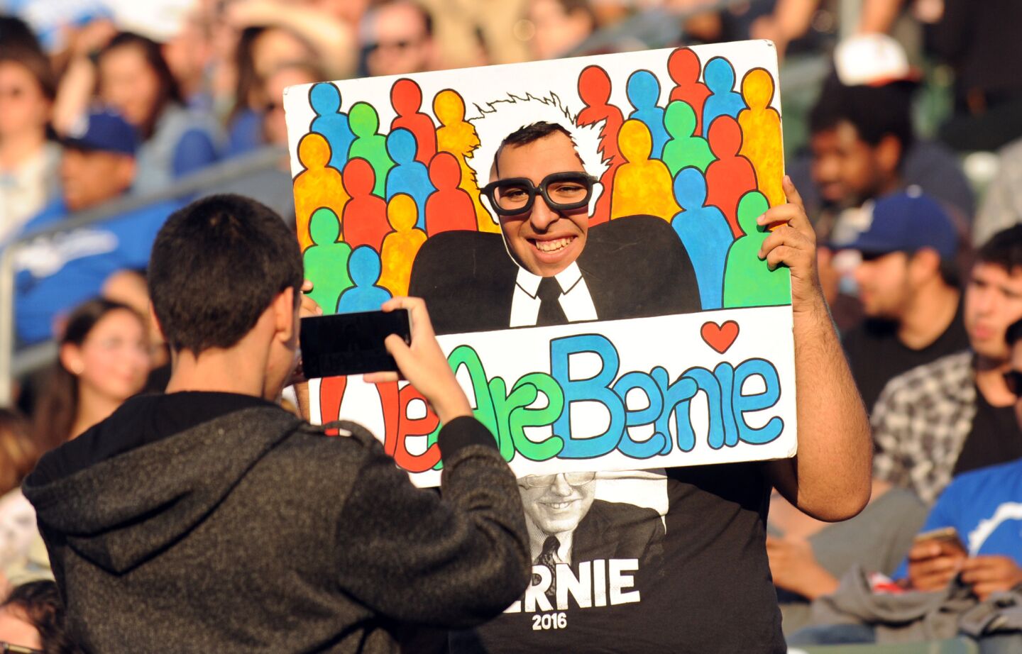 Supporters take their turns being Bernie for photos before the Sanders rally in Carson.