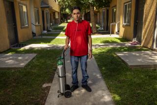 PACOIMA, CA-SEPTEMBER 8, 2023: Leobardo Segura Meza, 27, who suffers from silicosis, an incurable lung disease that has been afflicting workers who cut and polish engineered stone high in silica, is photographed outside of his apartment in Pacoima. (Mel Melcon / Los Angeles Times)