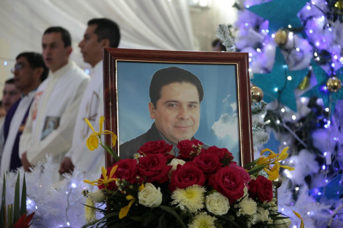 A portrait of Father Gregorio Lopez Gorostieta at his funeral Friday in Altamirano, Mexico.