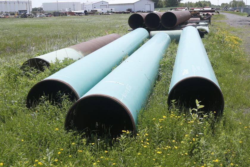 FILE - Pipeline used to carry crude oil is shown at the Superior, Wis., terminal of Enbridge Energy, June 29, 2018. The Biden administration is restoring federal regulations guiding environmental reviews of major infrastructure projects such as highways and pipelines that were scaled back by the Trump administration in a bid to fast-track the projects. A rule finalized Tuesday, April 19, 2022, will restore key provisions of the National Environmental Policy Act, a bedrock environmental law designed to ensure community safeguards during environmental reviews for a wide range of federal projects and decisions, the White House said. (AP Photo/Jim Mone, File)