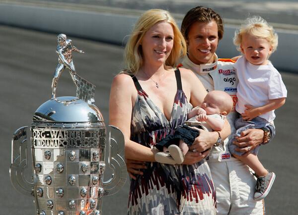 Dan Wheldon of England poses with his family the day after winning the Indianapolis 500 auto race in Indianapolis.