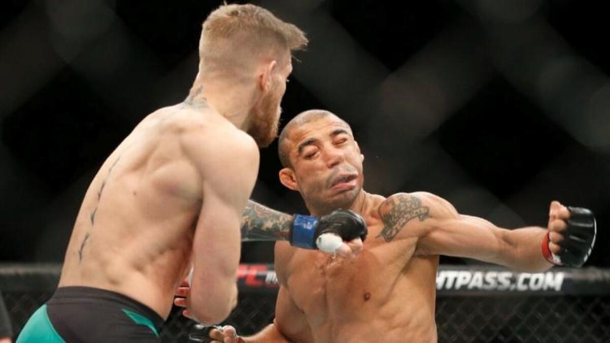 Conor McGregor, left, fights Jose Aldo at UFC 194 on Dec. 12, 2015. The bout ended with a knockout by McGregor in 13 seconds.