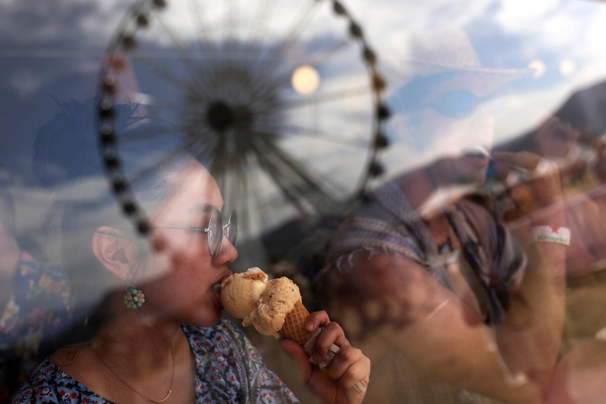 Festival-goers cool down with ice cream on April 21, 2018.