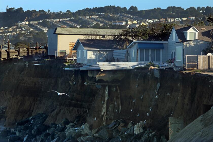 PACIFICA, CALIFORNIA--JAN. 20, 2019--Homes have already been condemned and some removed along Esplanade Ave. in Pacifica, CA. The town of Pacifica, just south of San Francisco, is ground zero for the issue of coastal erosion. On Jan. 20-21, the combination of ocean surge and a king tide caused high waves. Some homes and apartment building have already been lost to the forces of nature. (Carolyn Cole/Los Angeles Times)