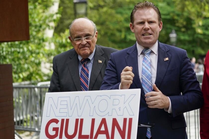 FILE - Andrew Giuliani, right, a Republican candidate for Governor of New York, is joined by his father, former New York City mayor Rudy Giuliani, during a news conference, June 7, 2022, in New York. One place the former New York City mayor is in high demand these days is on the campaign of his son, Andrew Giuliani, who on Tuesday is hoping to become the Republican nominee for governor of New York. (AP Photo/Mary Altaffer, File)