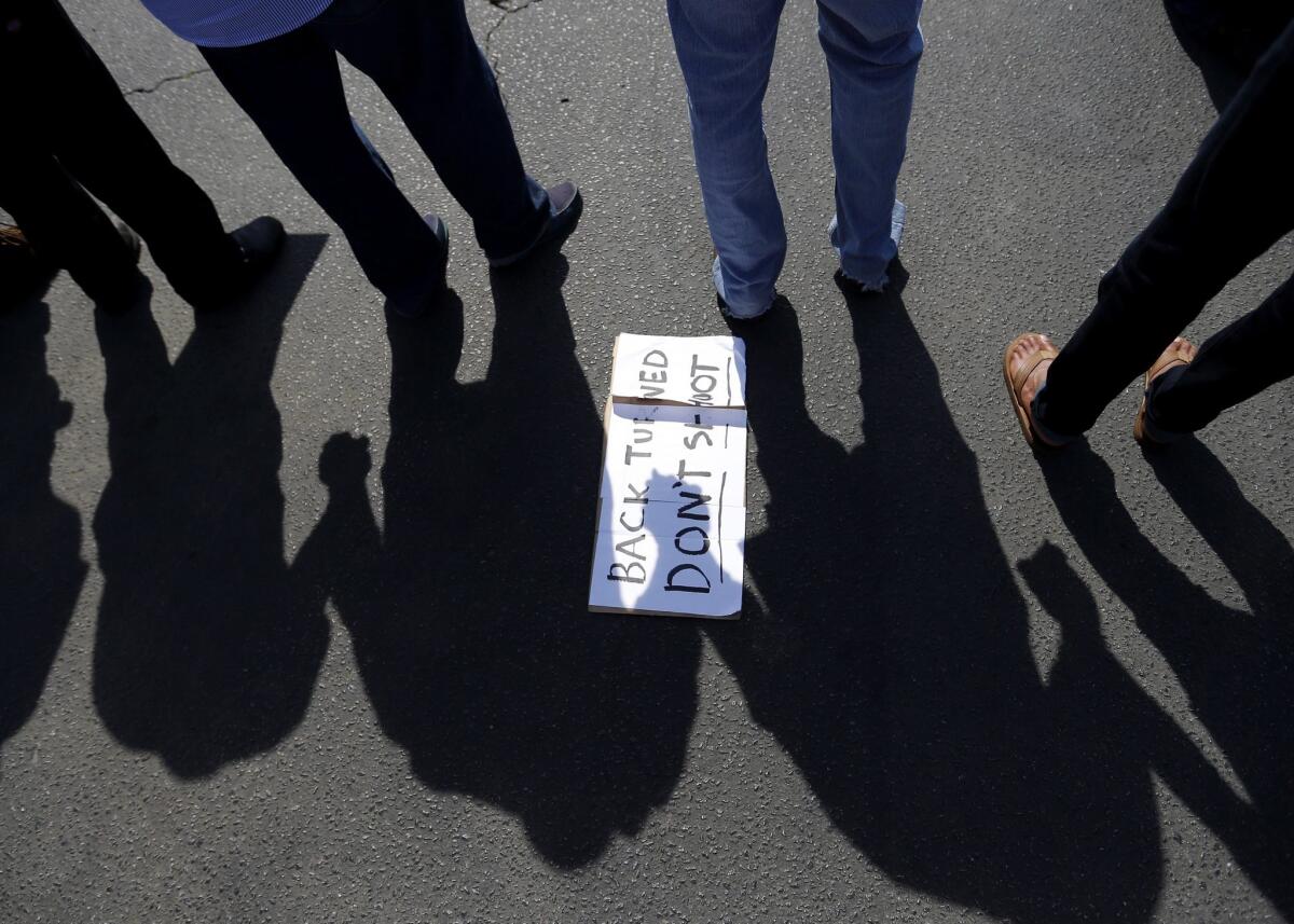 Protesters hold hands in a prayer circle April 8 after the shooting of Walter Scott.