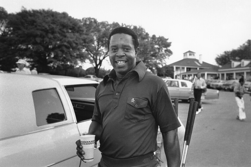 Lee Elder arrives at Augusta National for a practice round April 10, 1975