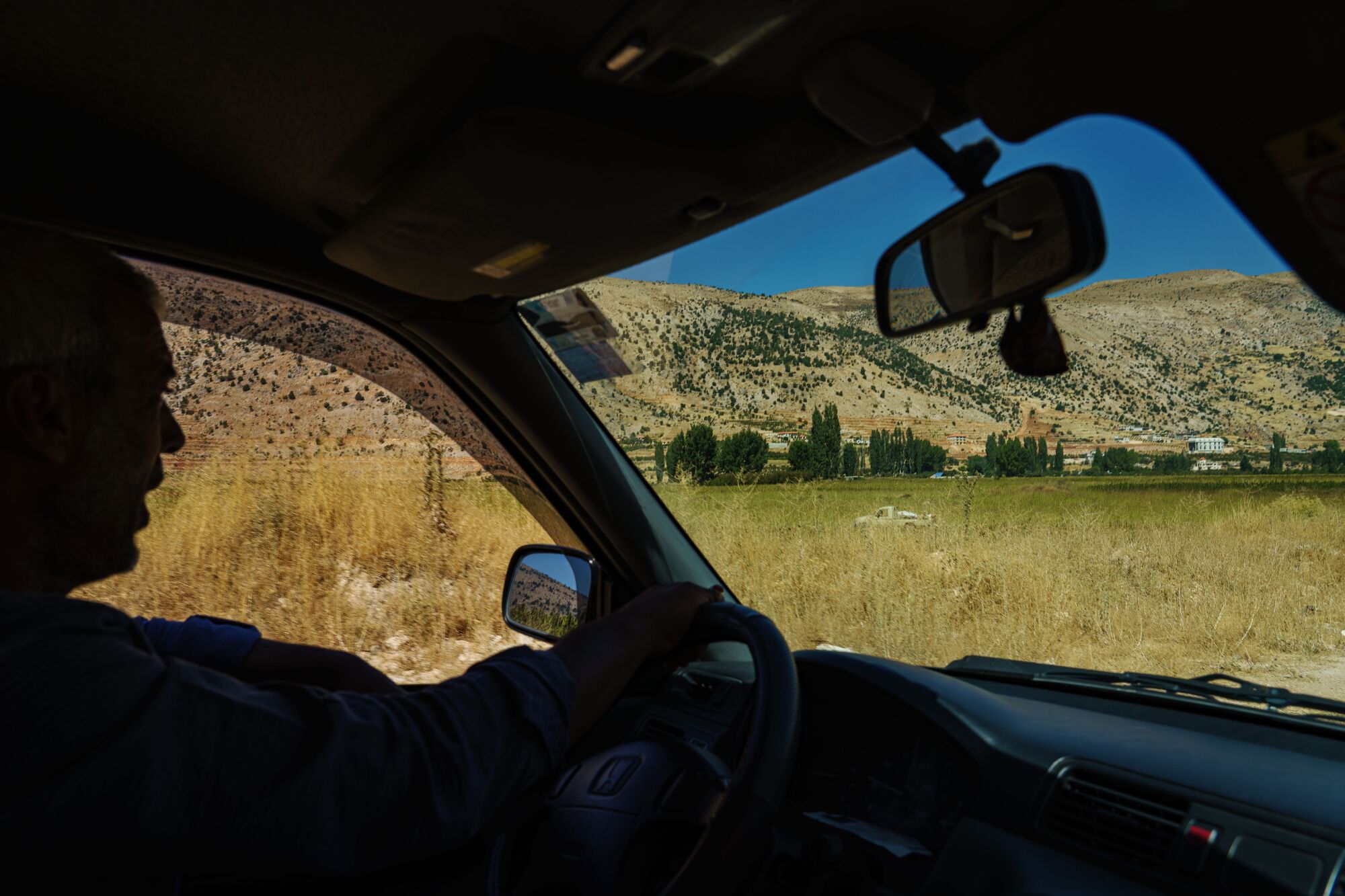 Farmer Ali Shreyf driving through Yammouneh, Lebanon.