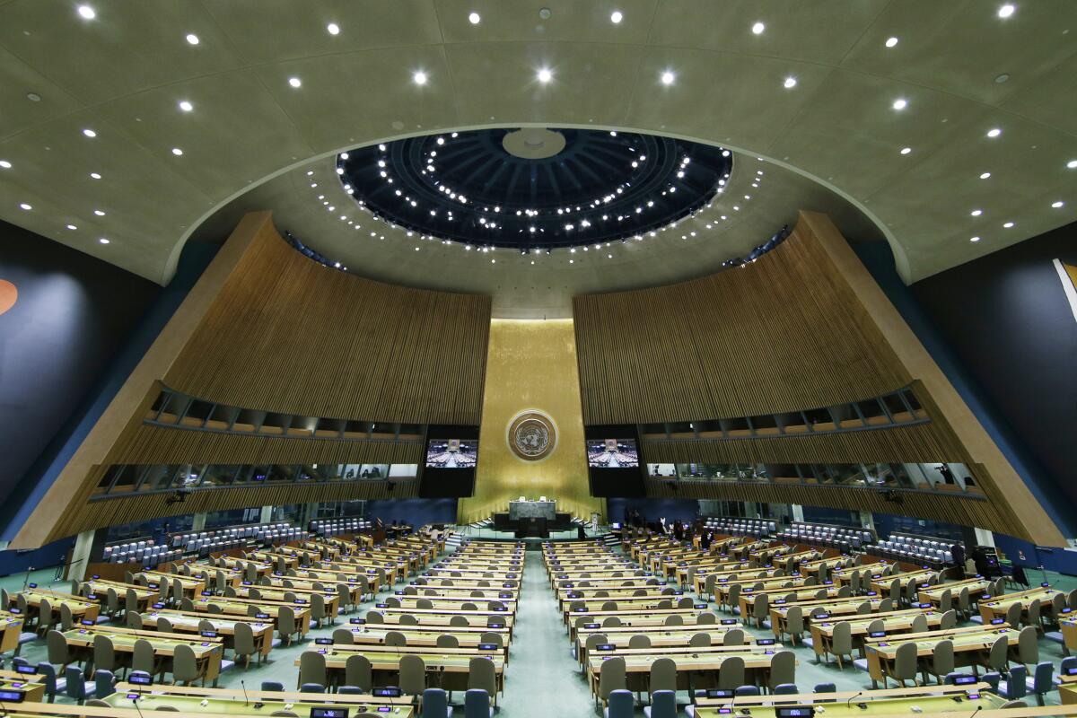 FILE - The United Nations General Assembly Hall sits empty before the start of the 76th Session of the General Assembly at U.N. headquarters on Sept. 20, 2021, in New York. A key U.N. committee has again blocked Myanmar’s military junta from taking the country’s seat at the United Nations, two well-informed U.N. diplomats said Wednesday, Dec. 14, 2022. (John Angelillo/Pool via AP, File)