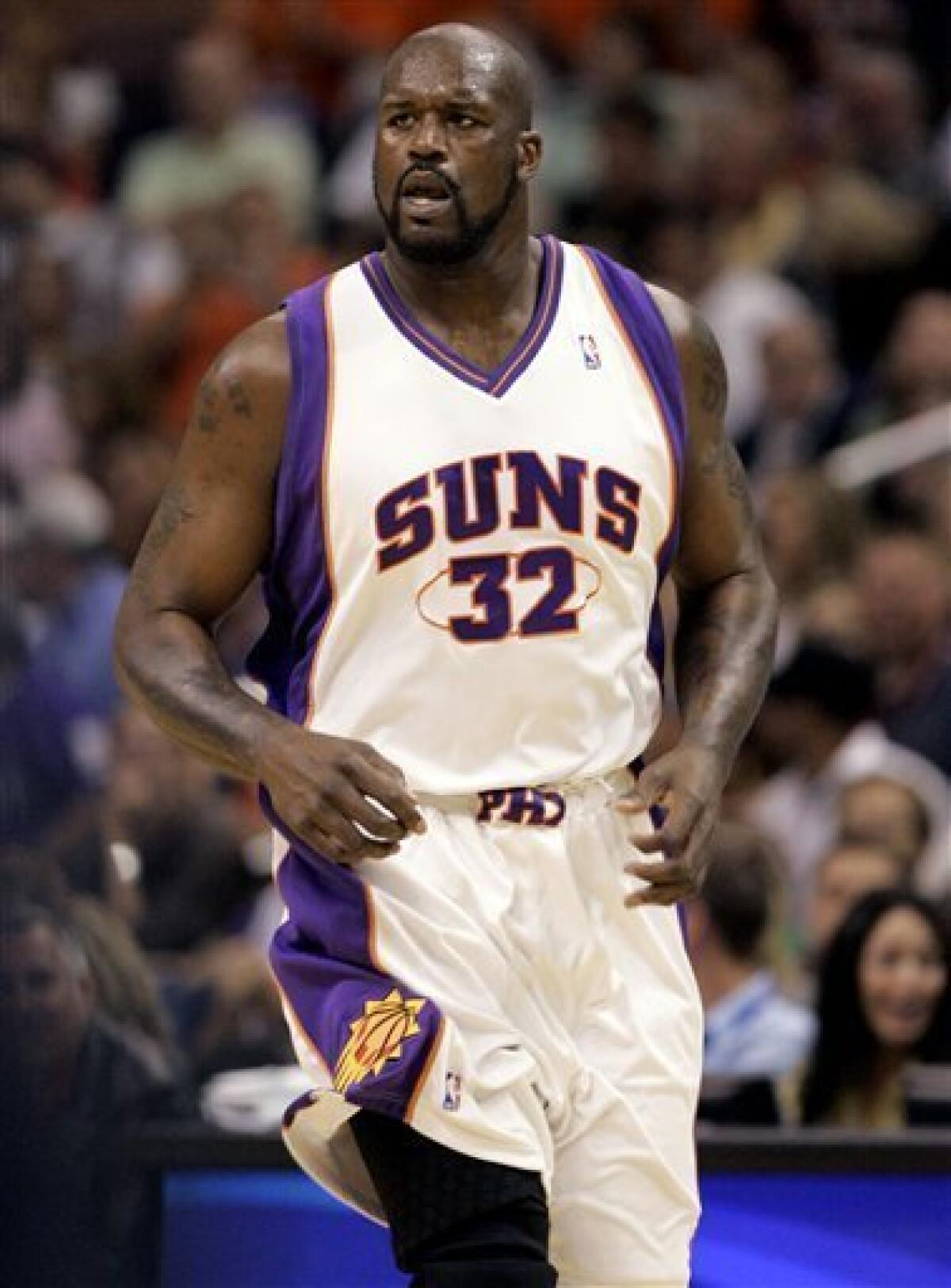 In this April 3, 2009 photo, Phoenix Suns center Shaquille O'Neal runs up the court against the Sacramento Kings during the first quarter of an NBA basketball game in Phoenix. The Cleveland Cavaliers are close to acquiring O'Neal in a trade that would pair him with MVP LeBron James, two people with knowledge of the deal told The Associated Press on Thursday, June 25, 2009. (AP Photo/Matt York)