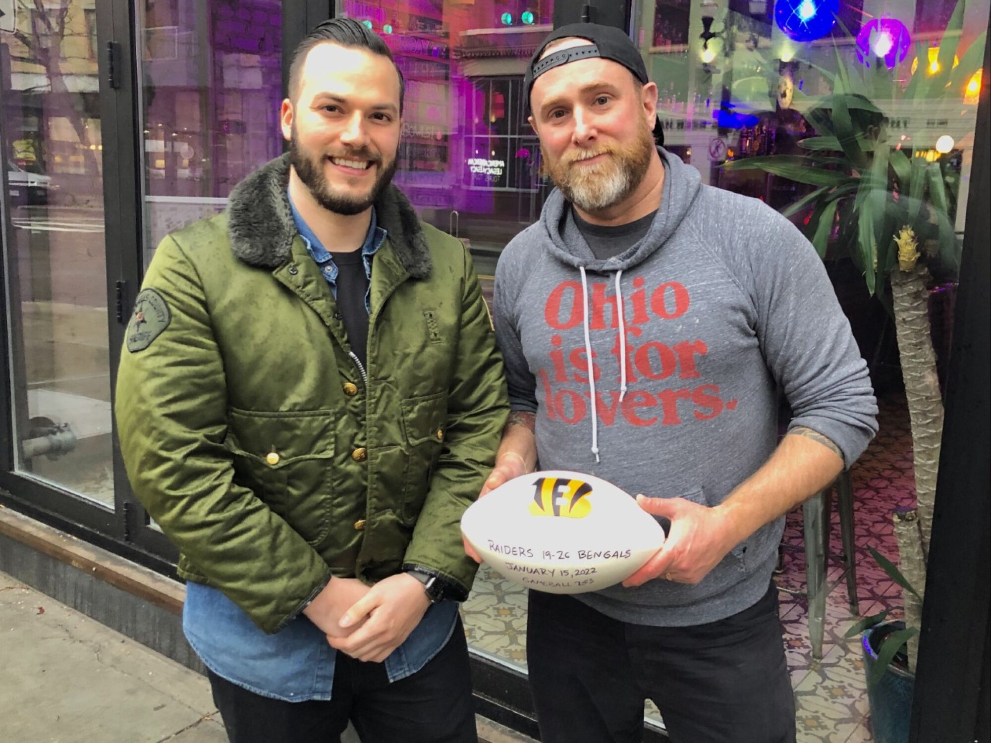 Tony Salcido (left) and Dan Wright show the game ball presented to them by their beloved Cincinnati Bengals.