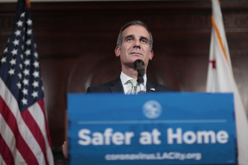 LOS ANGELES, CA., THURSDAY, MARCH 26, 2020 - LA Mayor Eric Garcetti delivers a daily Coronavirus briefing to cameras only as reporters listen via teleconference at City Hall. (Robert Gauthier/Los Angeles Times)