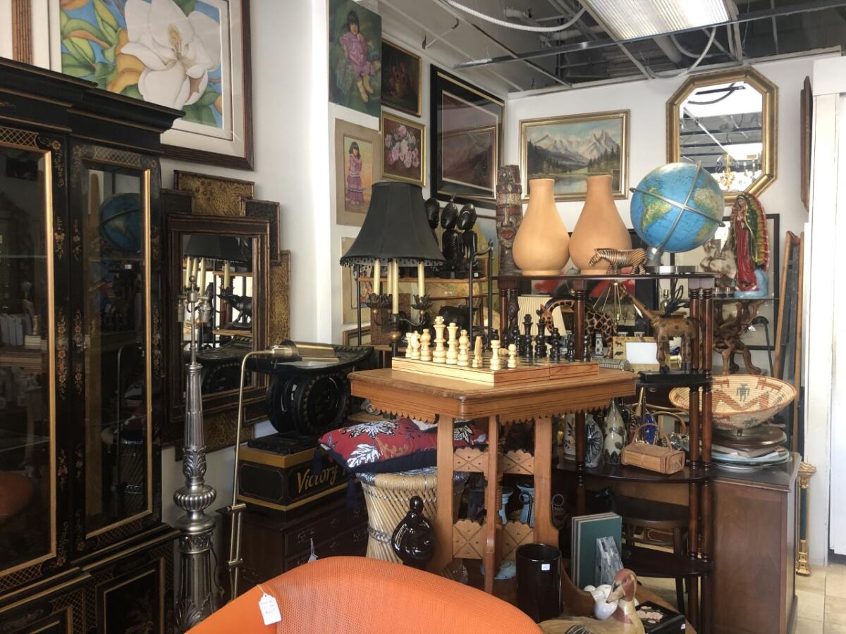 A jumble of furniture in a thrift store