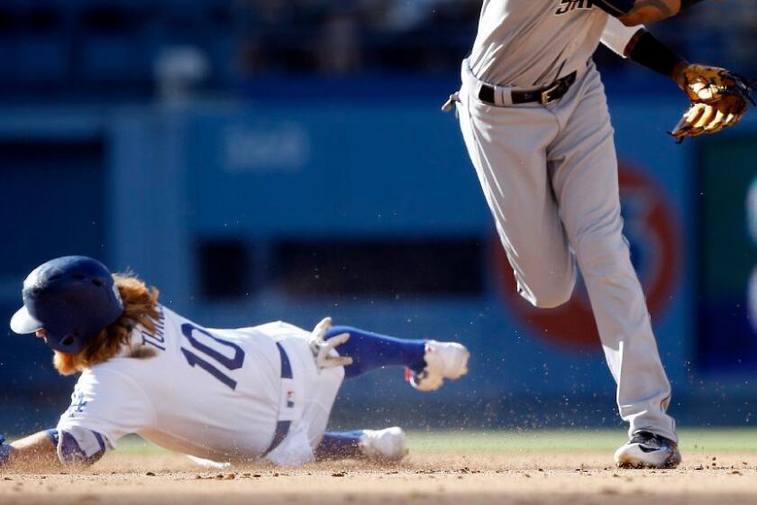 Justin Turner's slide into second base helped break up a potential double play leading to the Dodgers' go-ahead run in the fifth inning of a game Saturday.