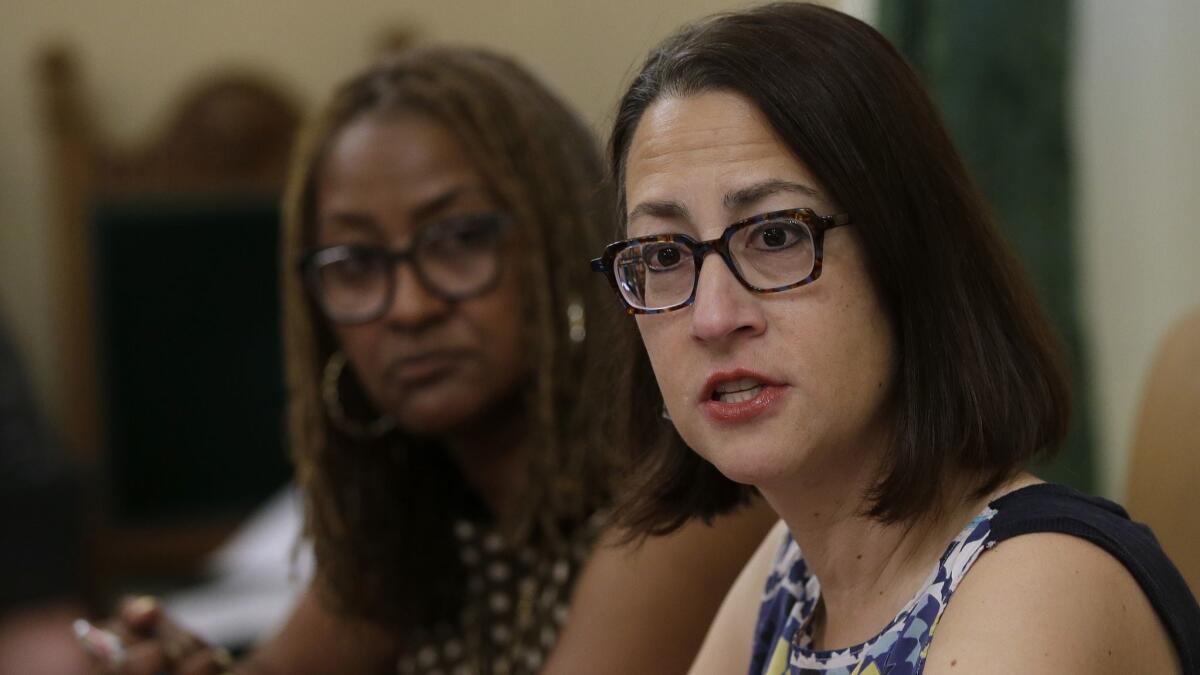 Assemblywoman Laura Friedman (D-Glendale), right, and state Sen. Holly Mitchell (D-Los Angeles) on Friday discuss a proposal for a new investigative unit to focus on harassment complaints in the Capitol.