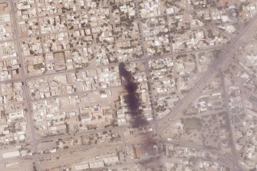 This satellite photo from Planet Labs PBC shows a fire near several hospitals in Khartoum, Sudan, Tuesday, April 18, 2023. Fighting between forces loyal to dueling generals raged in Sudan for a fifth day Wednesday, April 19, hours after an internationally brokered truce was supposed to have come into effect. (Planet Labs PBC via AP)