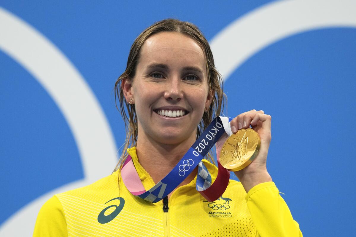 Emma Mckeon, of Australia, poses after winning the gold medal in the women's 50-meter freestyle final at the 2020 Summer Olympics, Sunday, Aug. 1, 2021, in Tokyo, Japan. (AP Photo/Gregory Bull)