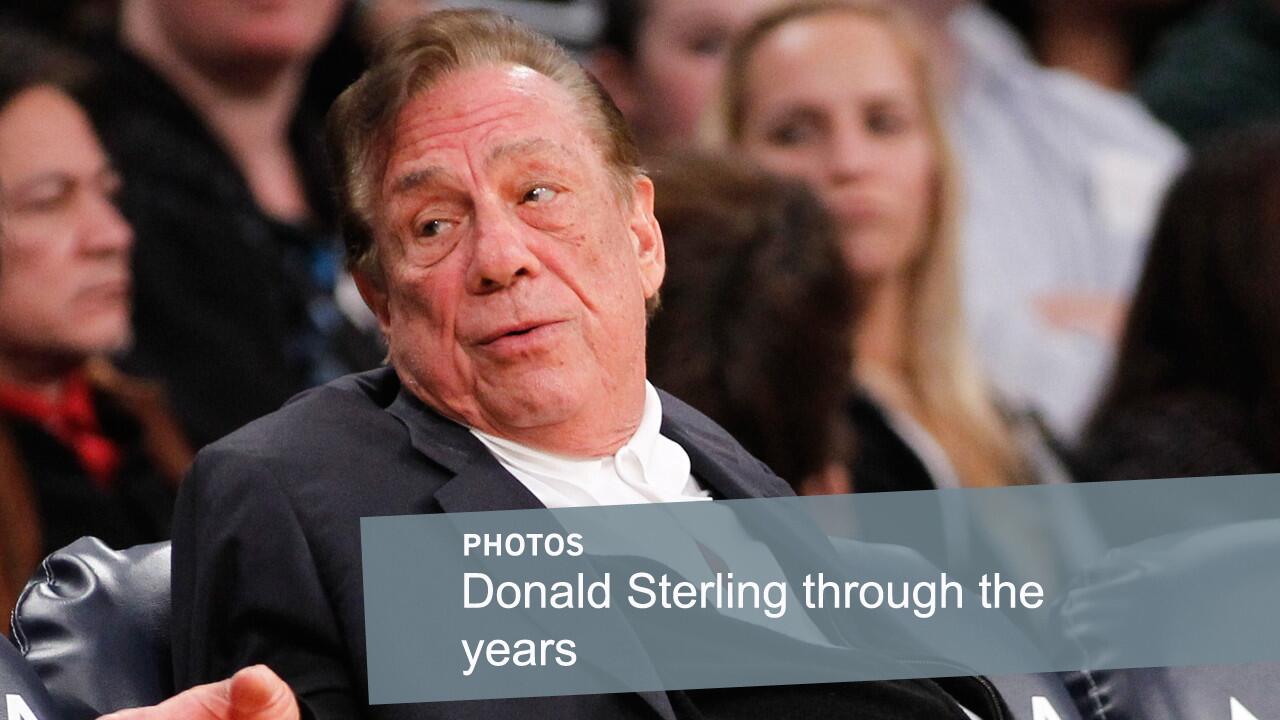 Former Clippers owner Donald Sterling gestures while attending a game between the Clippers and Lakers in December 2011. Sterling lost his legal fight to prevent the sale of the Clippers after remarks he made about blacks led to a lifetime ban from the NBA.