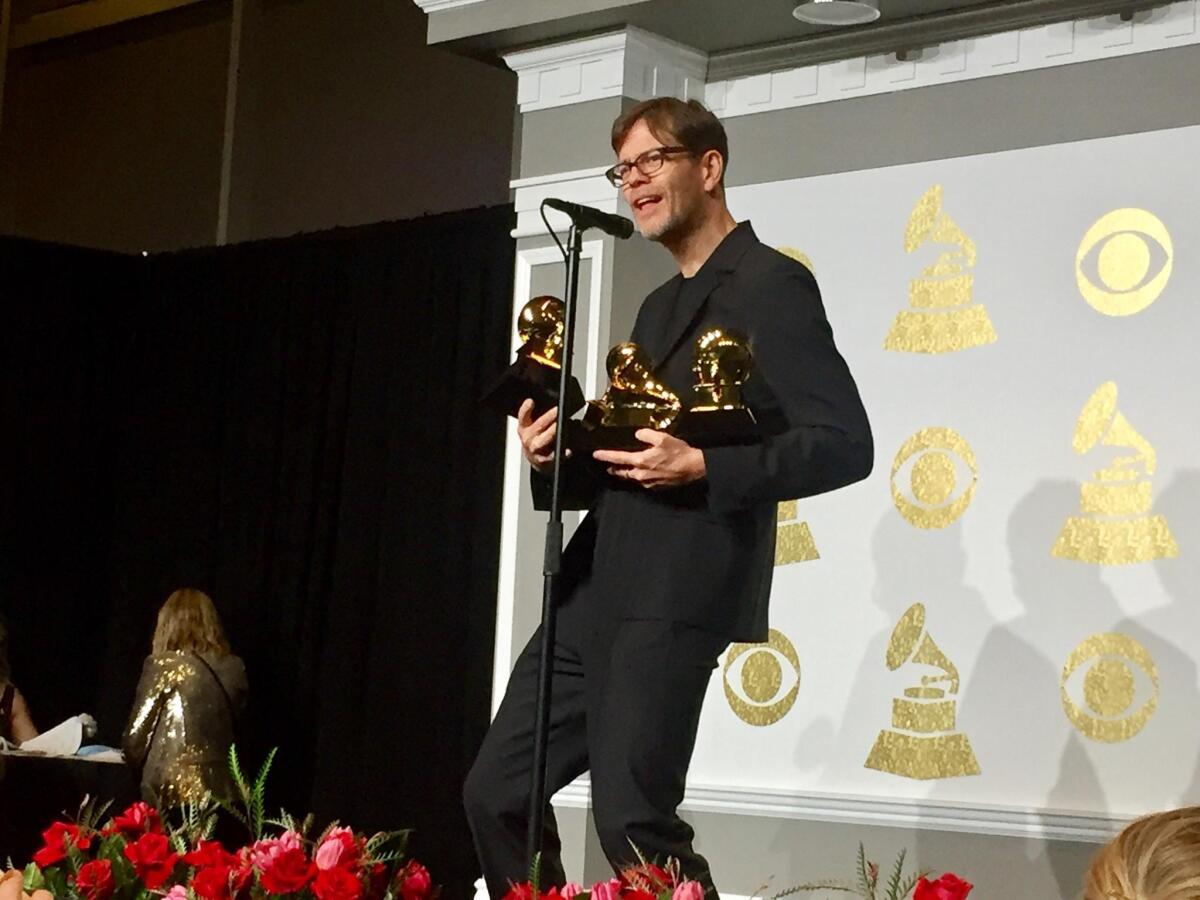 Donny McCaslin, backstage at the 59th Grammy Awards, with his haul of trophies.