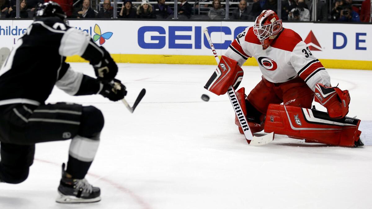 Kings left wing Tanner Pearson puts a shot on goal against Carolina's Scott Darling during overtime Saturday.