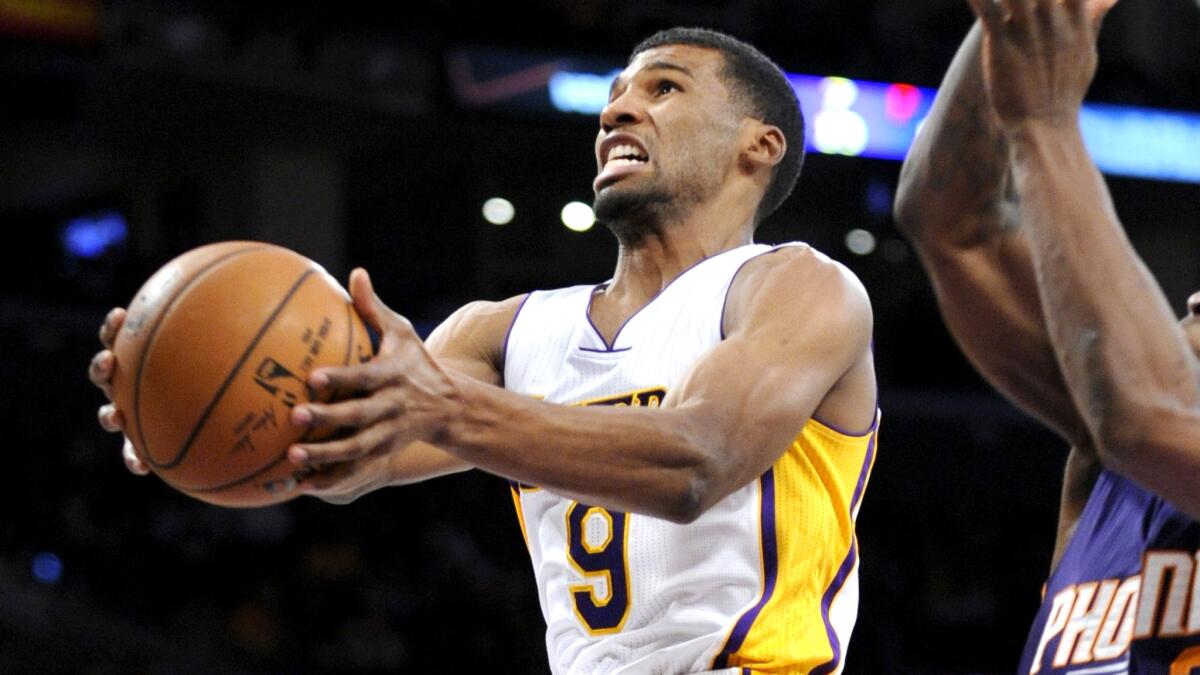 Lakers guard Ronnie Price puts up a shot in a game against Phoenix this season.