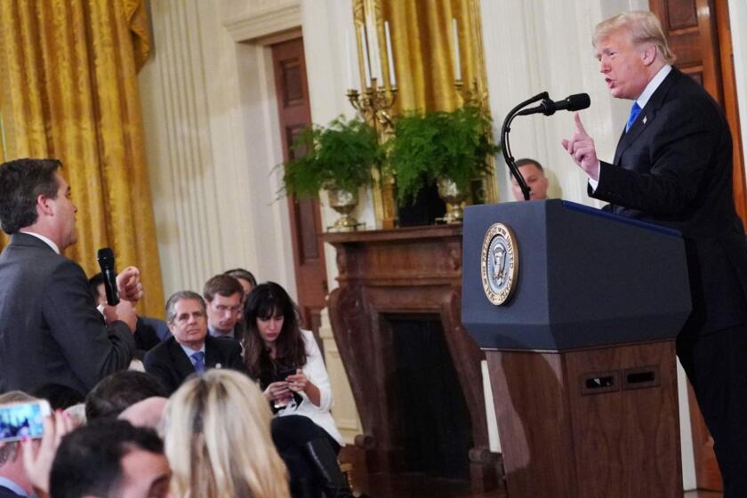 (FILES) In this file photo taken on November 07, 2018, US President Donald Trump (R) gets into a heated exchange with CNN chief White House correspondent Jim Acosta (L) during a post-election press conference in the East Room of the White House in Washington, DC. - CNN sued Donald Trump's administration November 13, 2018, alleging the White House violated journalist Jim Acosta's rights under the constitution by revoking his press credentials following a heated exchange with the US president. "The wrongful revocation of these credentials violates CNN and Acosta's First Amendment rights of freedom of the press, and their Fifth Amendment rights to due process," the news network said in a statement announcing the lawsuit. "We have asked this court for an immediate restraining order requiring the pass be returned to Jim, and will seek permanent relief as part of this process." (Photo by MANDEL NGAN / AFP)MANDEL NGAN/AFP/Getty Images ** OUTS - ELSENT, FPG, CM - OUTS * NM, PH, VA if sourced by CT, LA or MoD **