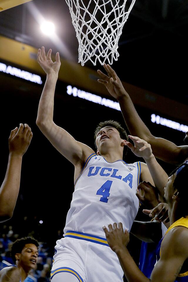 UCLA guard Jaime Jaquez Jr. tips in a basket during the first half of the Bruins' 93-64 victory over San Jose State at Pauley Pavilion.