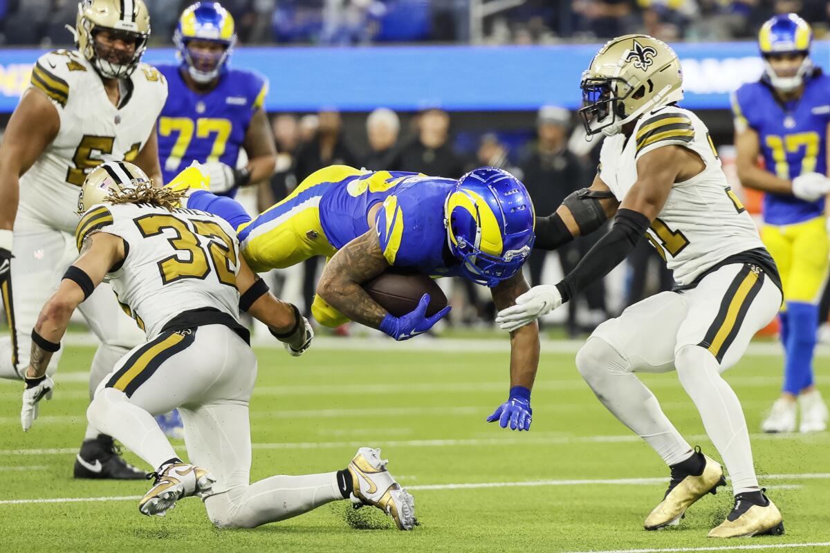 Rams running back Kyren Williams is tackled by Saints safety Tyrann Mathieu during the third quarter.