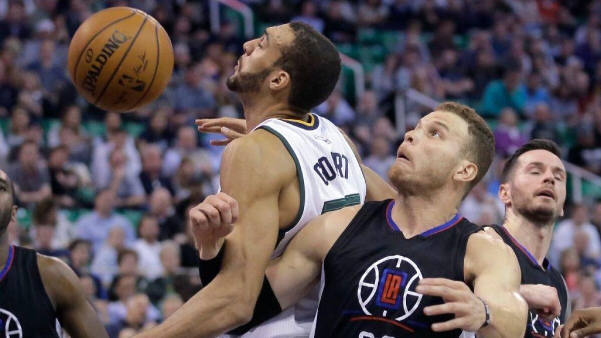Clippers forward Blake Griffin (32) fouls Utah Jazz center Rudy Gobert during the second half on Mar. 13.