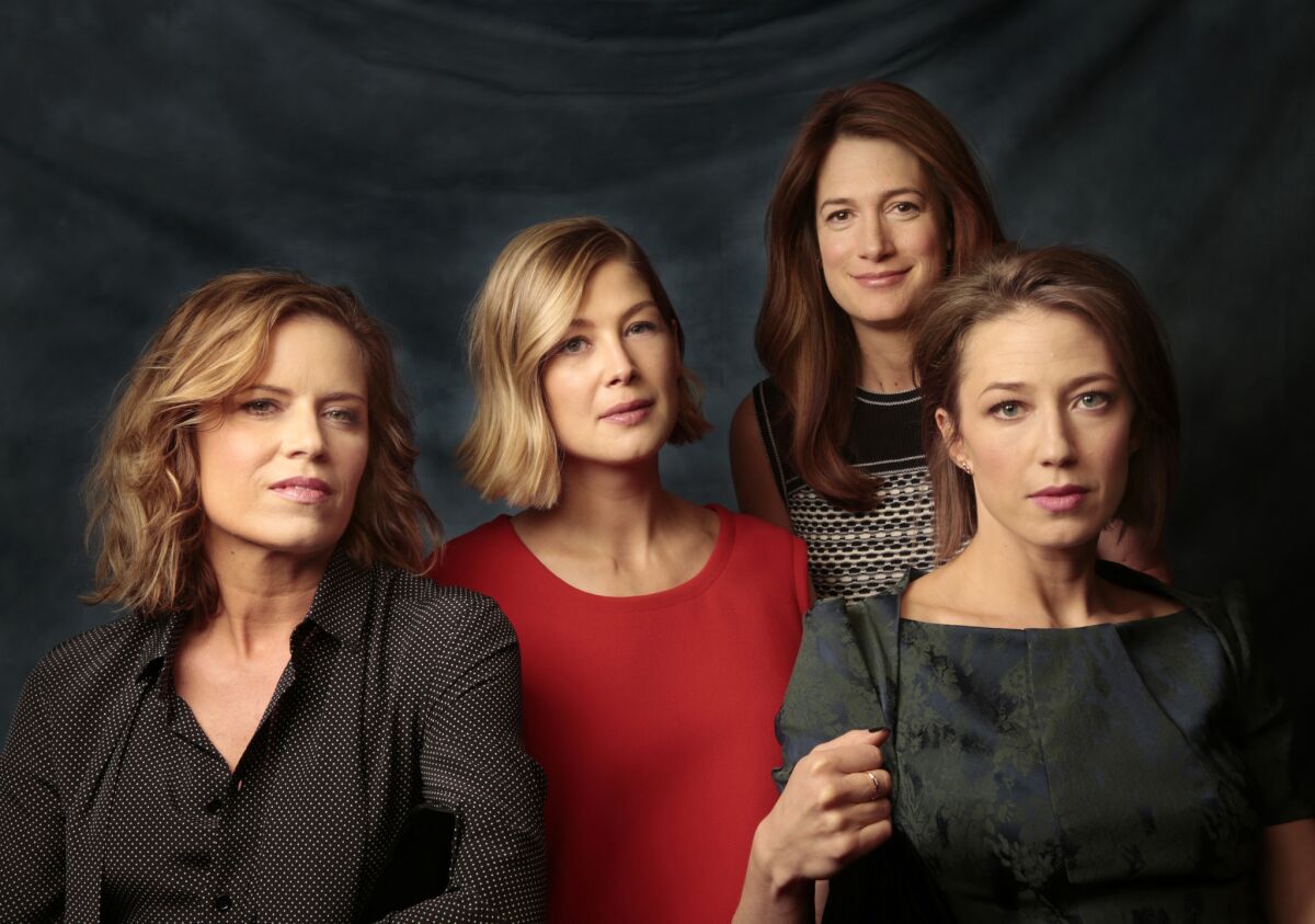 The actresses in "Gone Girl" include, foreground from left, Kim Dickens, Rosamund Pike and Carrie Coon, joined by author and screenwriter Gillian Flynn in back.