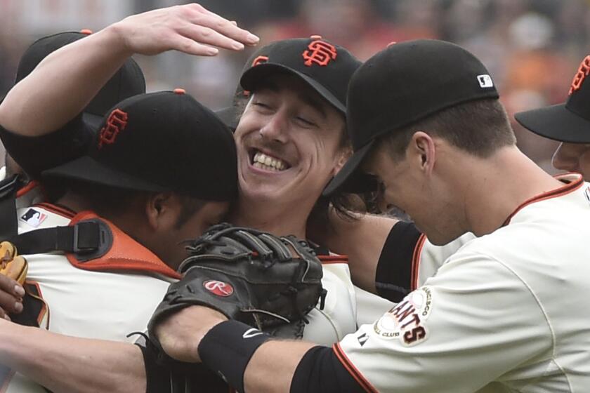 San Francisco Giants starter Tim Lincecum, center, smiles as he celebrates with his teammates after throwing a no-hitter in a 4-0 win over the San Diego Padres on Wednesday.