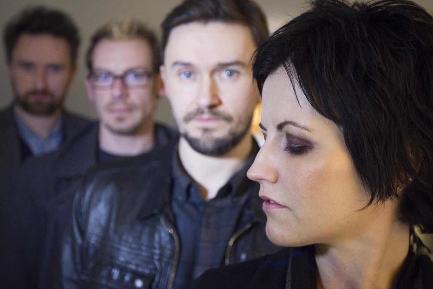 Irish rock band the Cranberries lead singer Dolores O'Riordan poses with guitar player Noel Hogan, from left, drummer Fergal Lawler and bassist Mike Hogan on Jan. 18, 2012, in Paris.