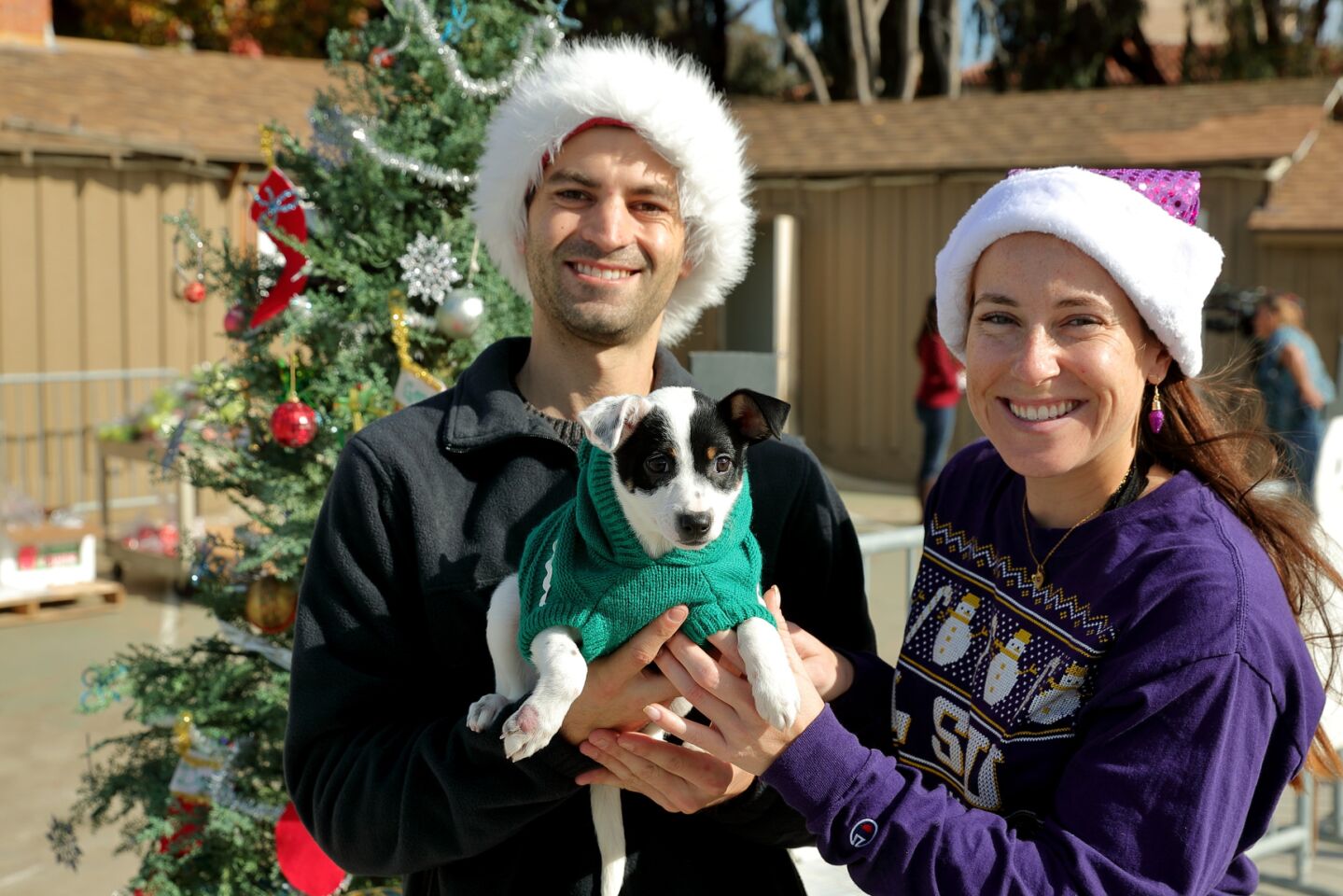 Eric Rossicone (Graphic Design Manager) and Claire Ramirez (Special Events Assistant) with "Santa's Helper"