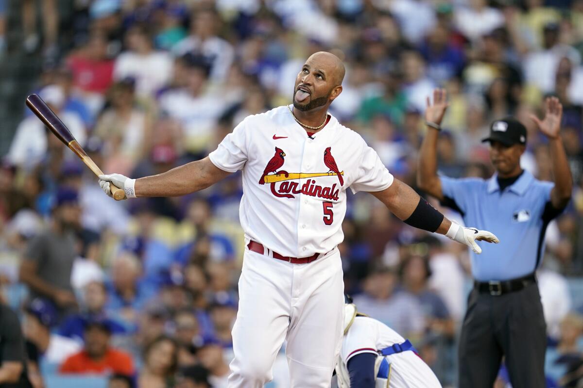 National League's Albert Pujols reacts as he bats during the MLB All-Star baseball Home Run Derby.